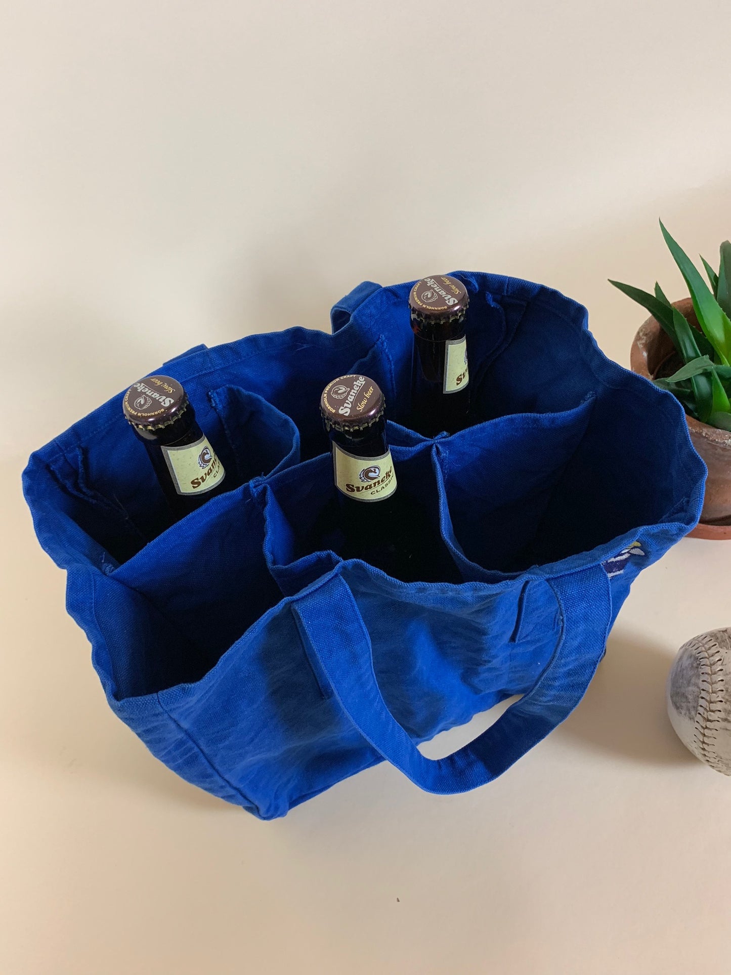 Tygpåse med välkänt Irma-motiv och plats för flaskor