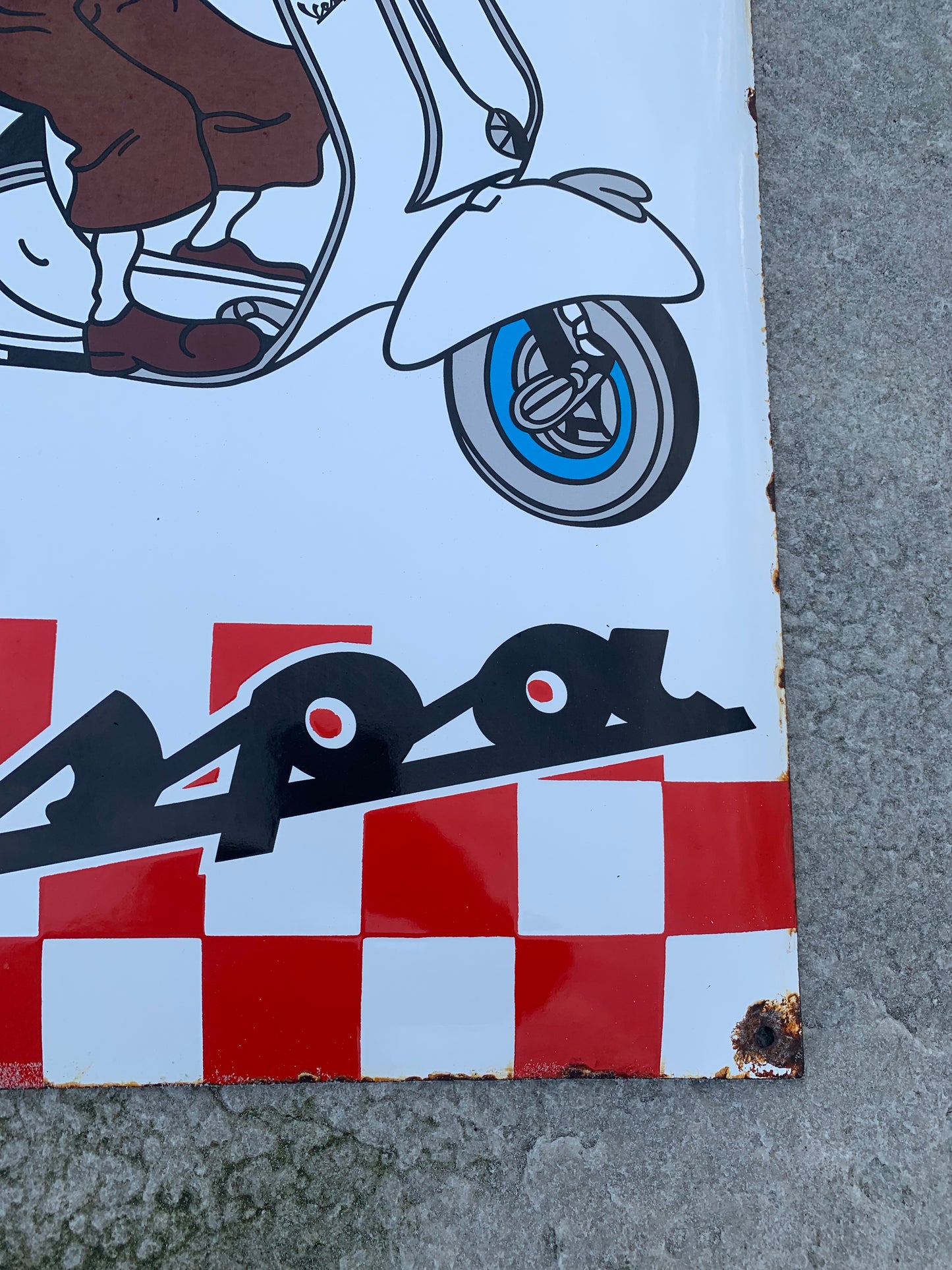 Tintin och Vespa-skylt